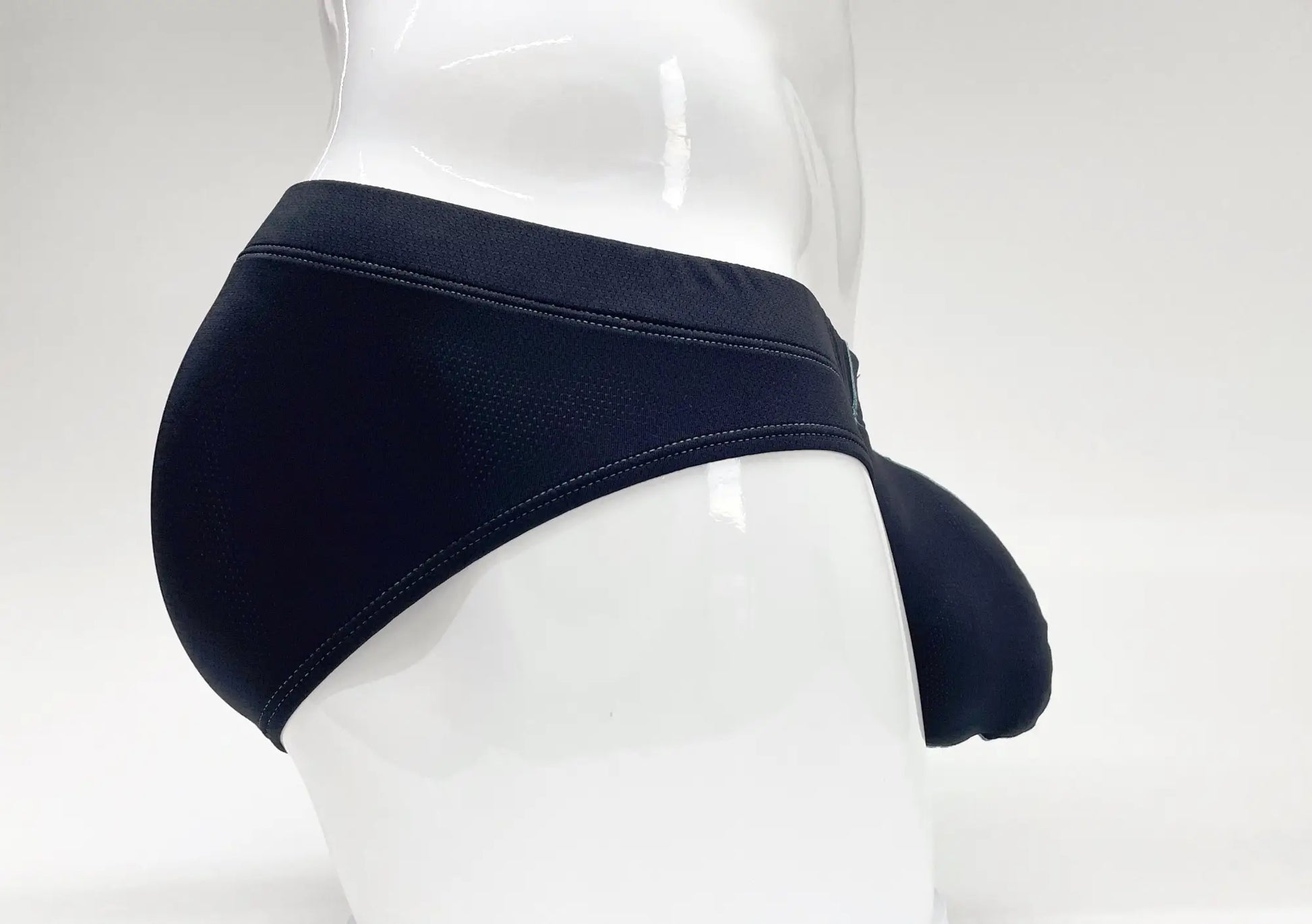 Stitch big boy pouch brief blue in black form-fitting swim trunks with smooth stretchy fabric and reinforced waistband stitching