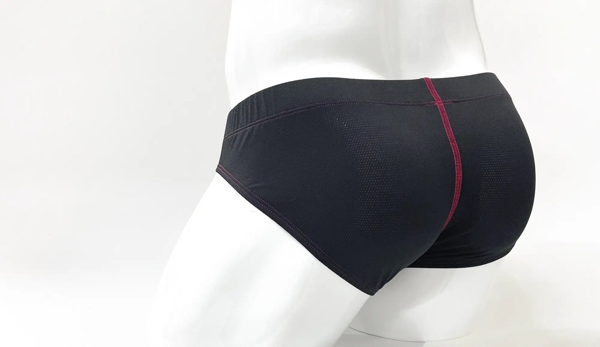 Black stitch big boy pouch brief with subtle textured pattern and contrasting red stitching on center seam