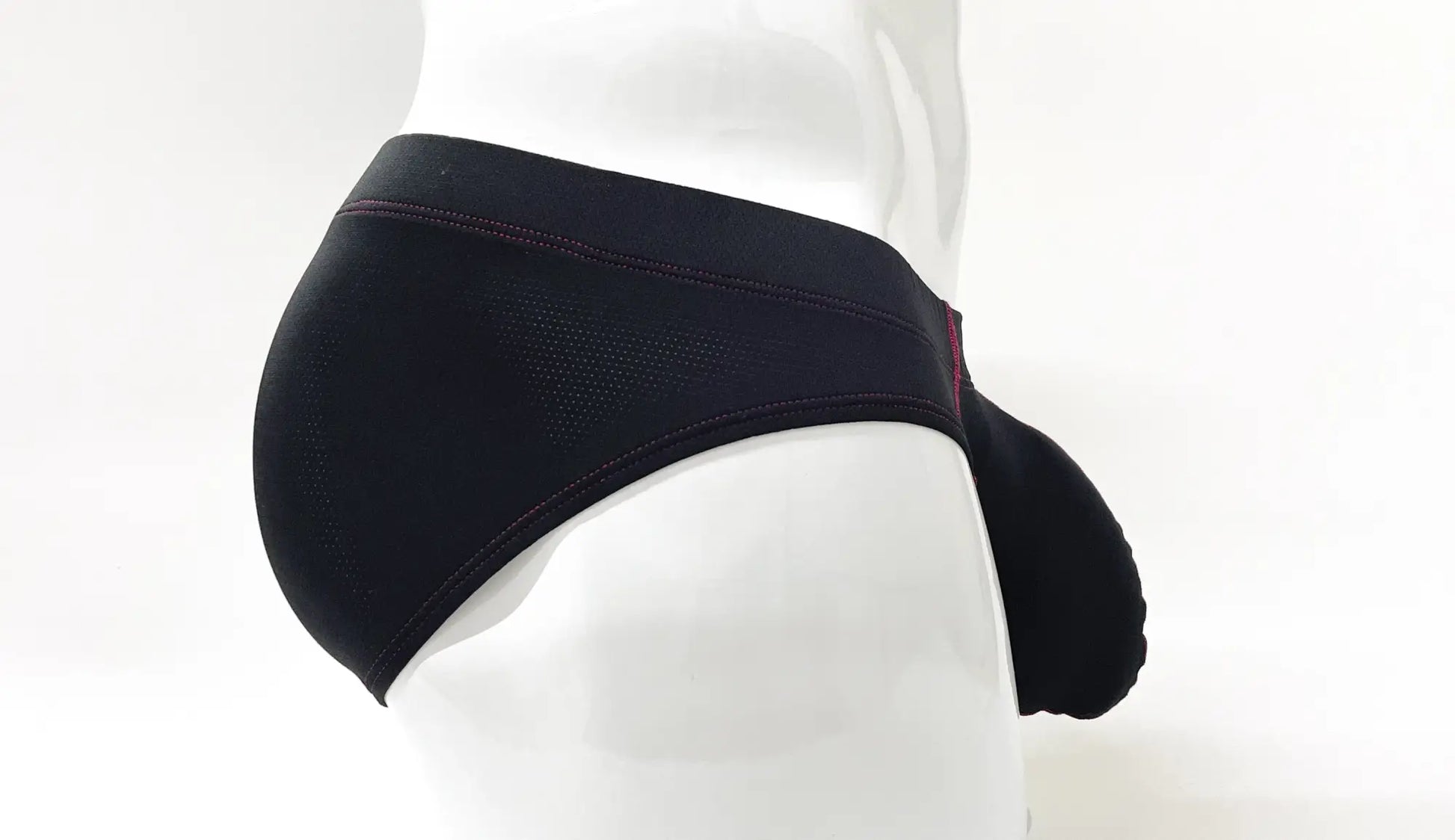 Black stitch big boy pouch brief with textured fabric and subtle red stitching detail for athletic use