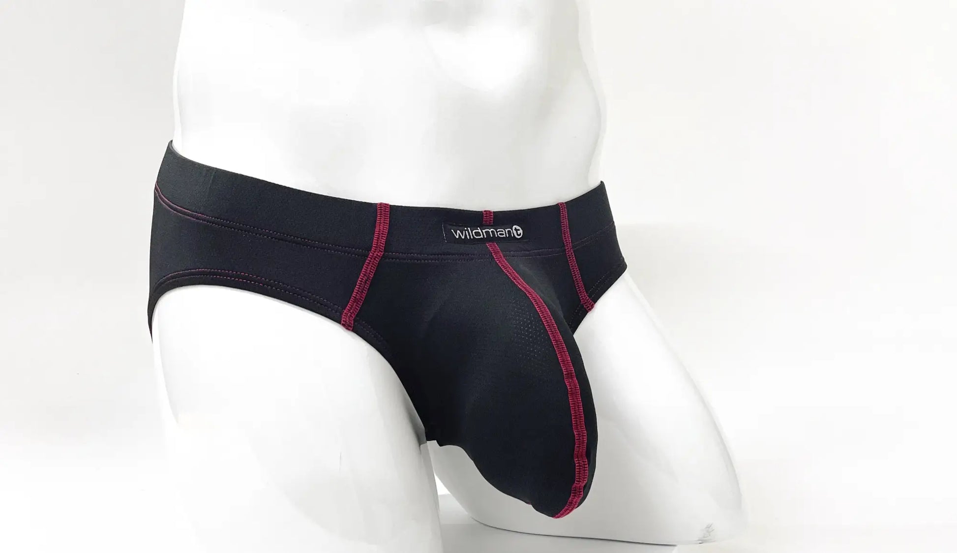 Black men’s briefs with red stitching and wildman brand label on waistband from stitch big boy pouch brief red collection