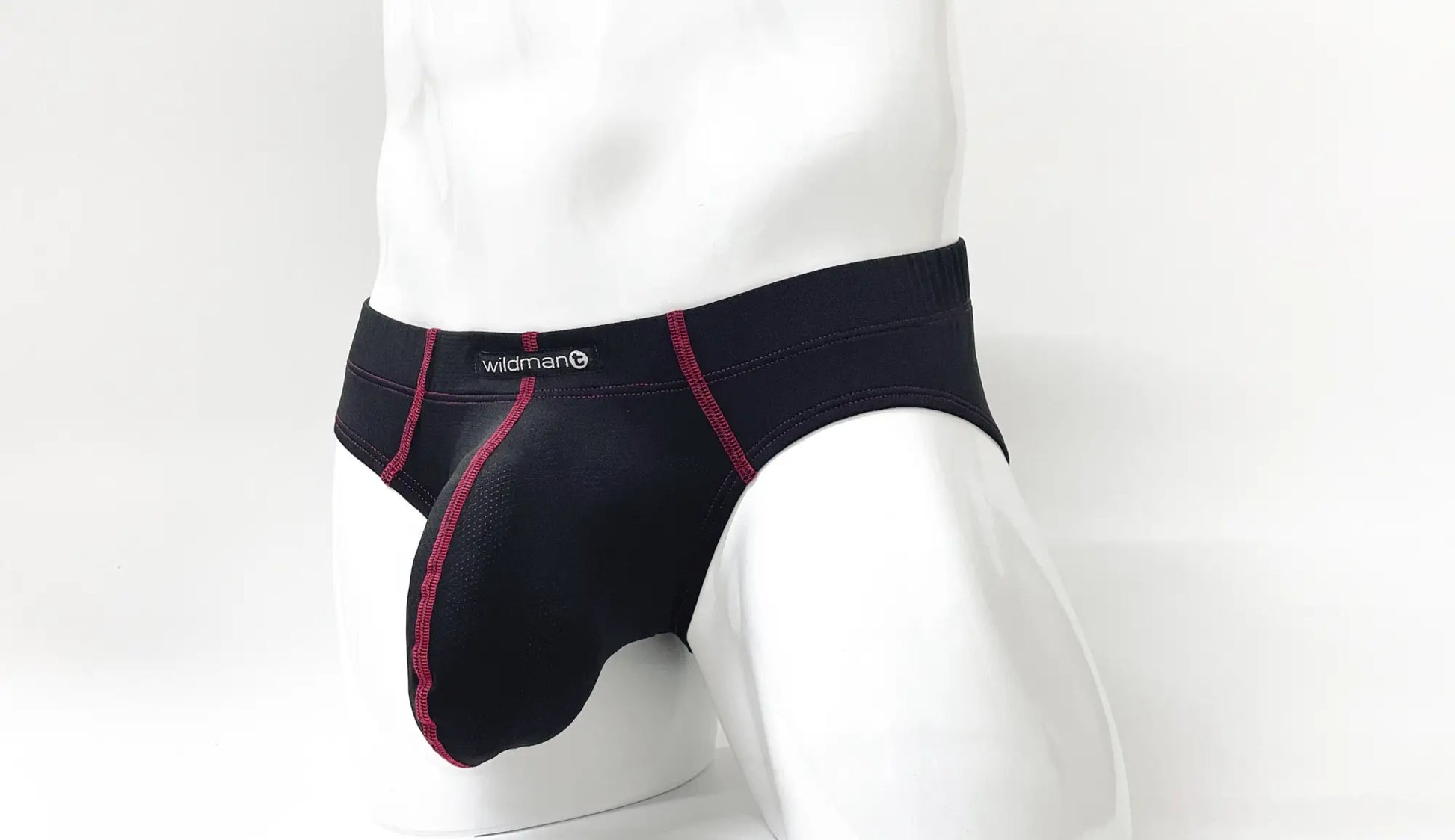 Black mens briefs with red stitching and wildman logo on waistband stitch big boy pouch brief red front view