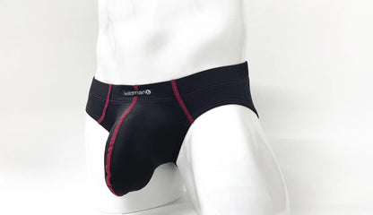 Black mens briefs with red stitching and wildman logo on waistband stitch big boy pouch brief red front view