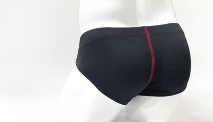 Back view of stitch big boy pouch brief mesh swim trunks in black with a red seam down the center back
