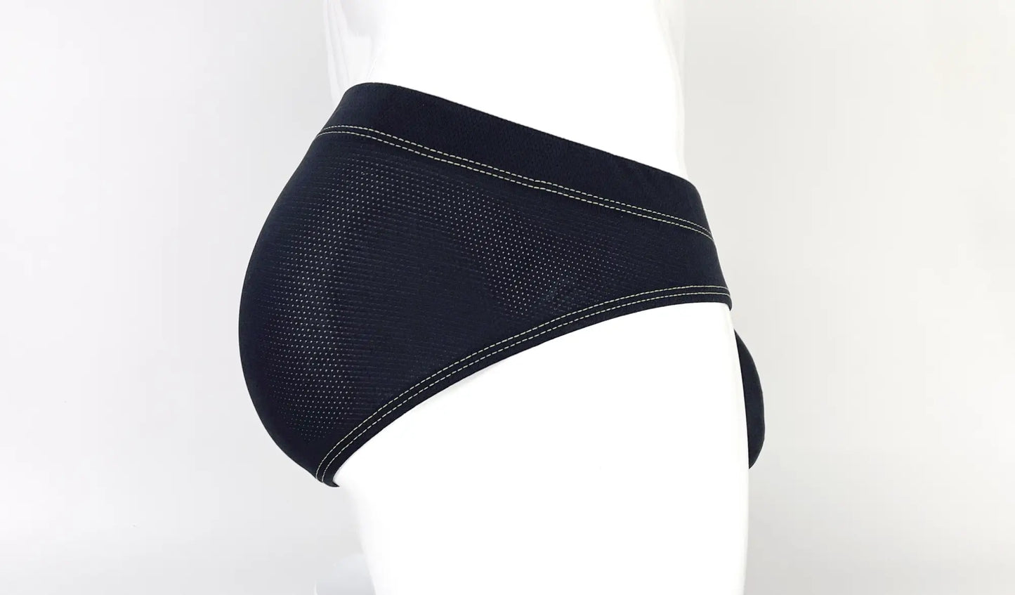 Black mesh stitch big boy pouch brief with white stitching along waistband and leg openings in yellow style