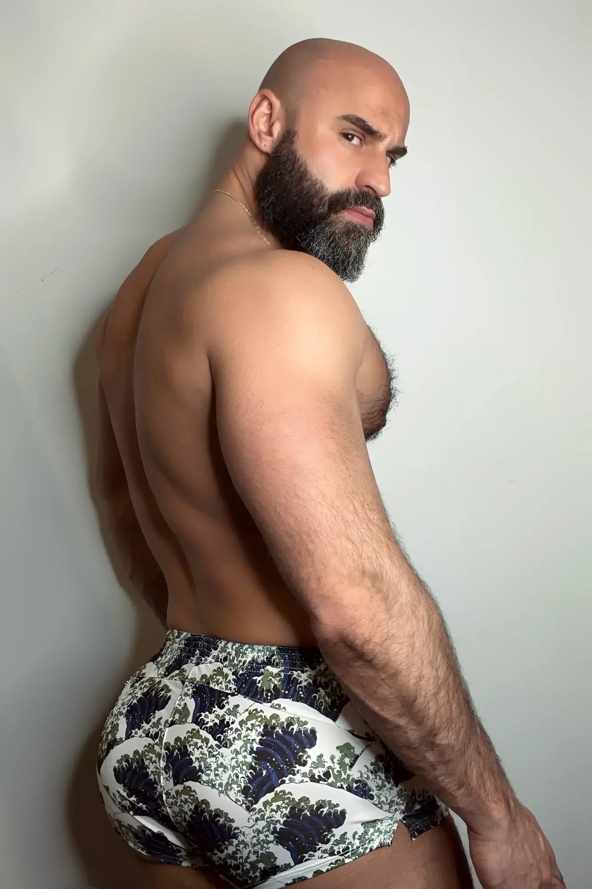 Stretch-It 2 athletic short shorts with bold dark blue and green wave pattern on white stretch fabric for active wear