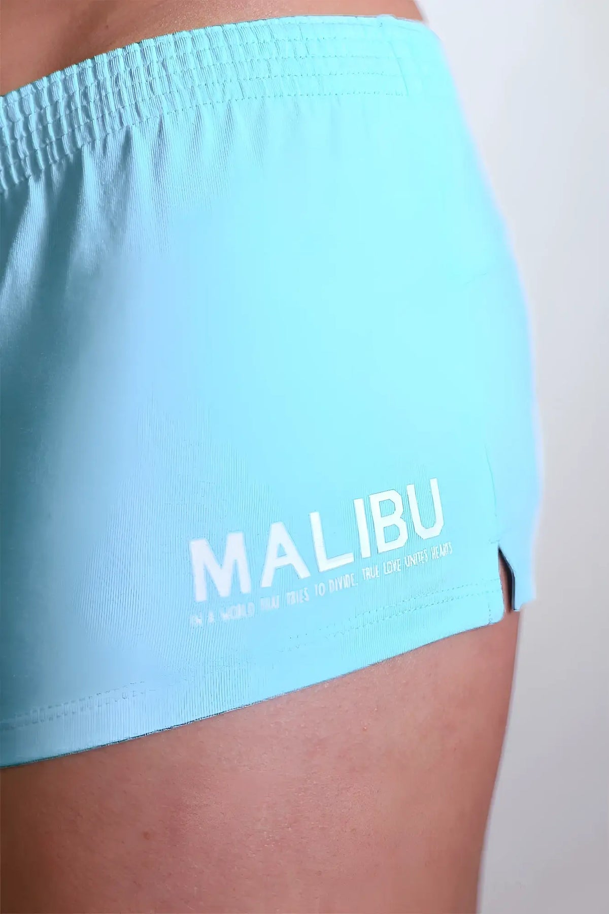 Light blue electric blue stretch-it 2 inch athletic shorts with white malibu logo and tagline on the side