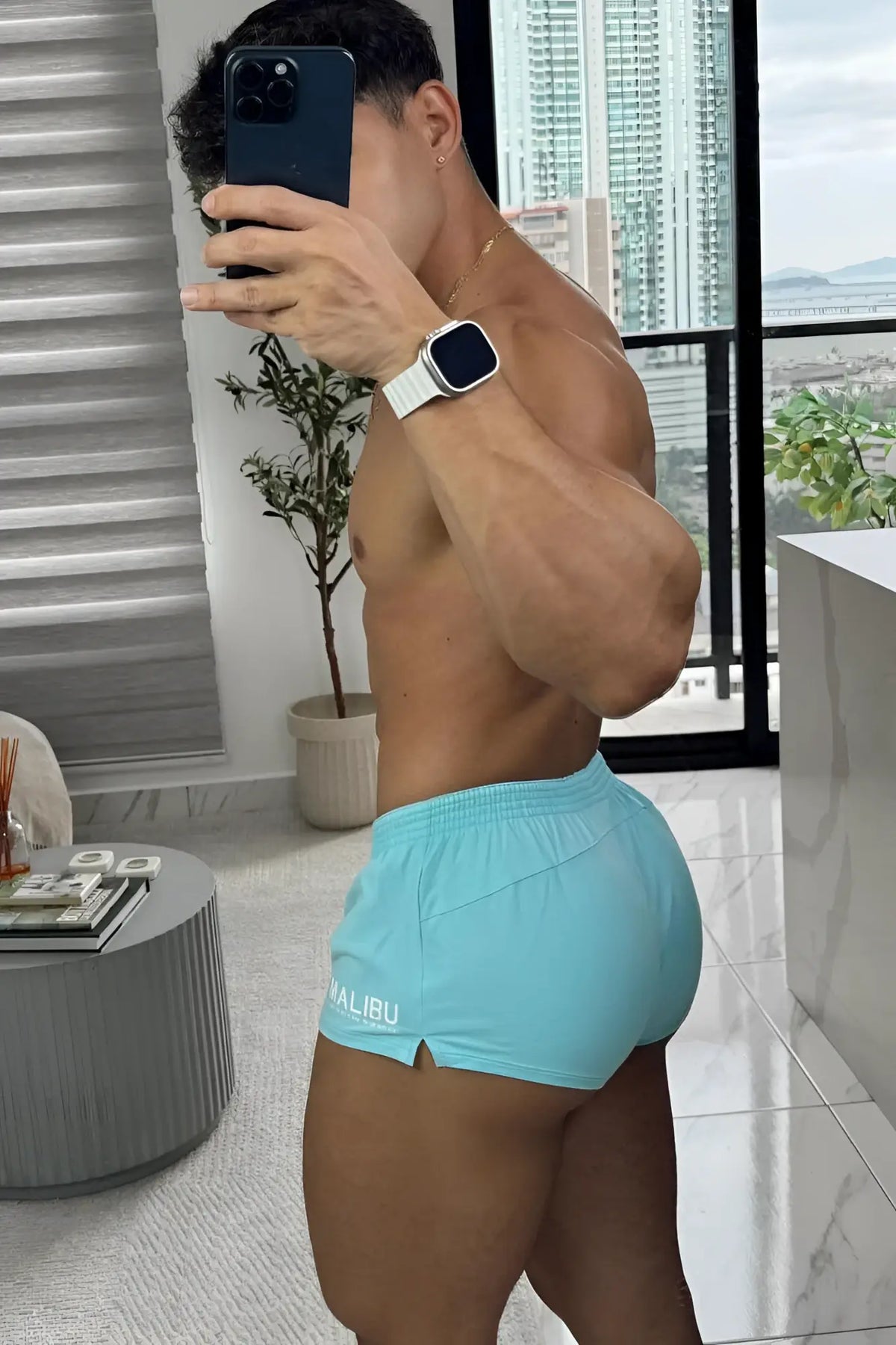 Light blue stretch-it 2 inch athletic shorts with white logo on left leg designed for flexibility and comfort