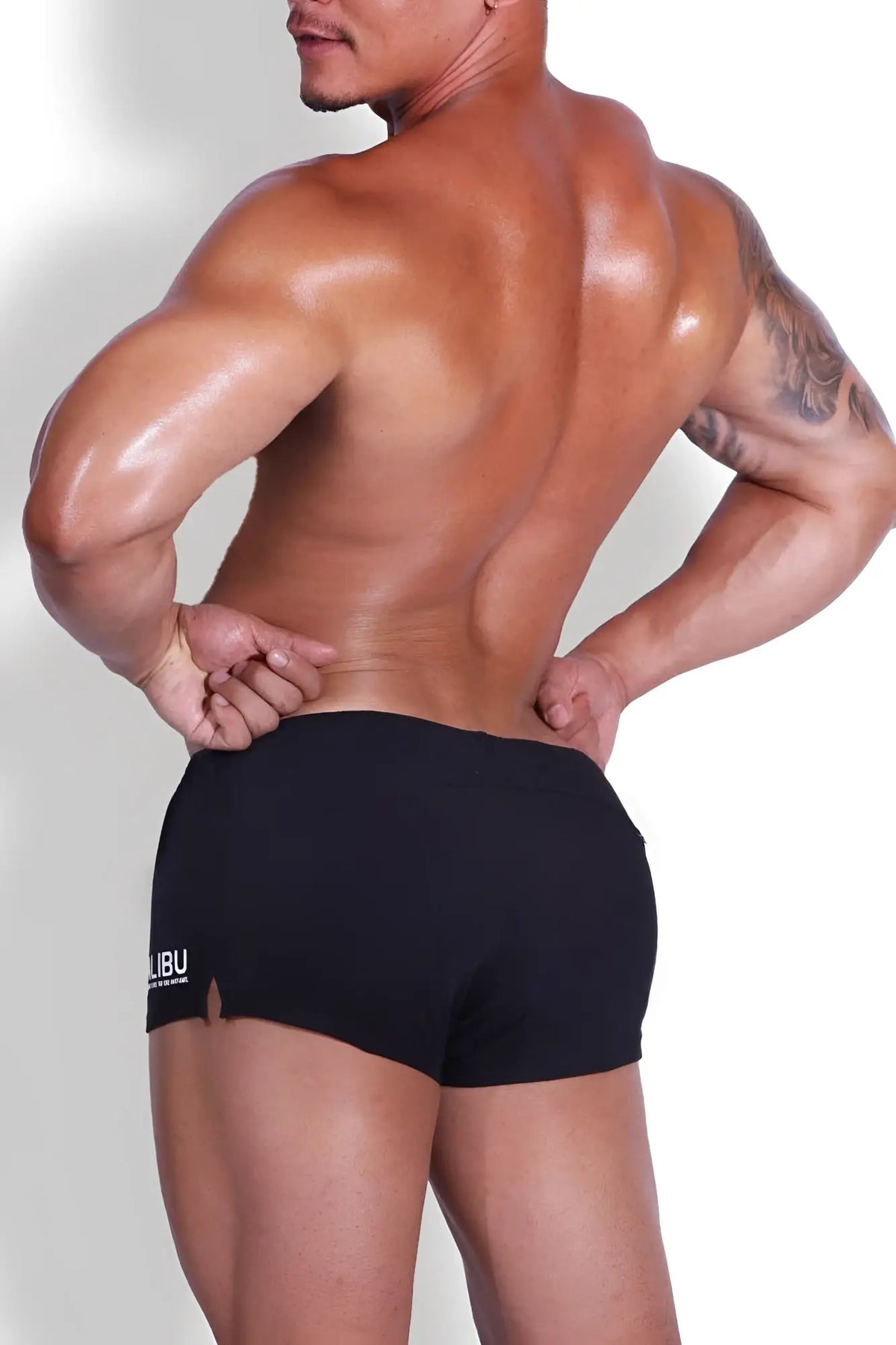Black athletic stretch-it 2 inch short shorts with a small white logo on the left leg for active wear
