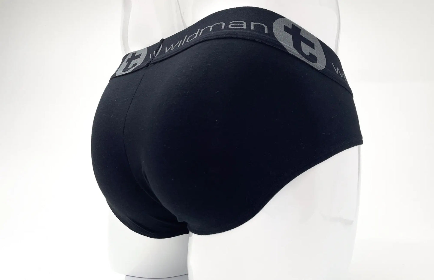 Black stretch cotton big boy pouch briefs with gray elastic waistband featuring wildman logo and circular emblem