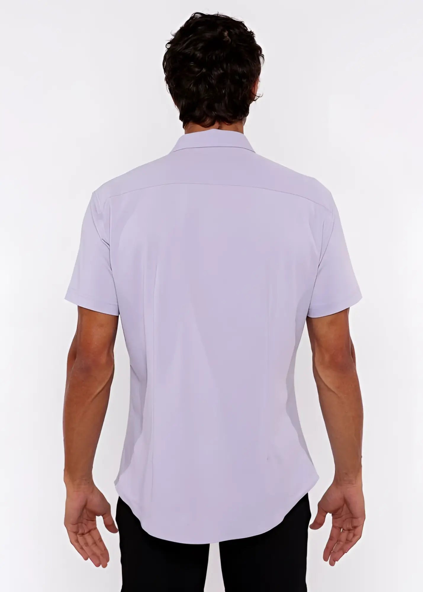 A man wearing a lavender stretch knit shirt with a classic collar and tailored fit in lightweight fabric