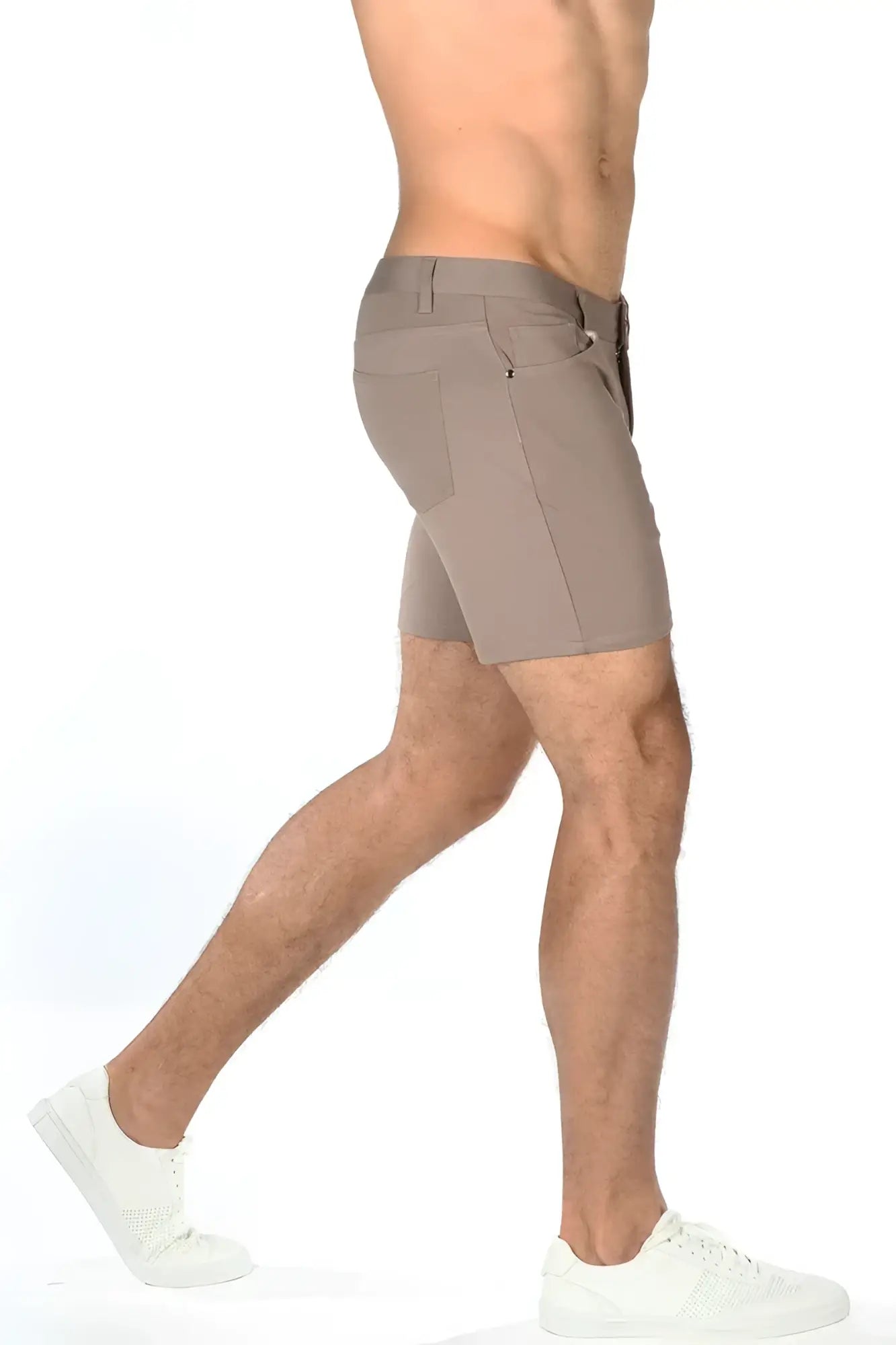 Beige stretch knit short with sleek modern design and subtle stitching details for athletic wear