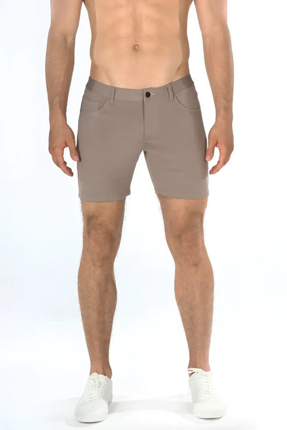 Beige stretch knit shorts with sleek modern design and subtle stitching details for versatile casual wear