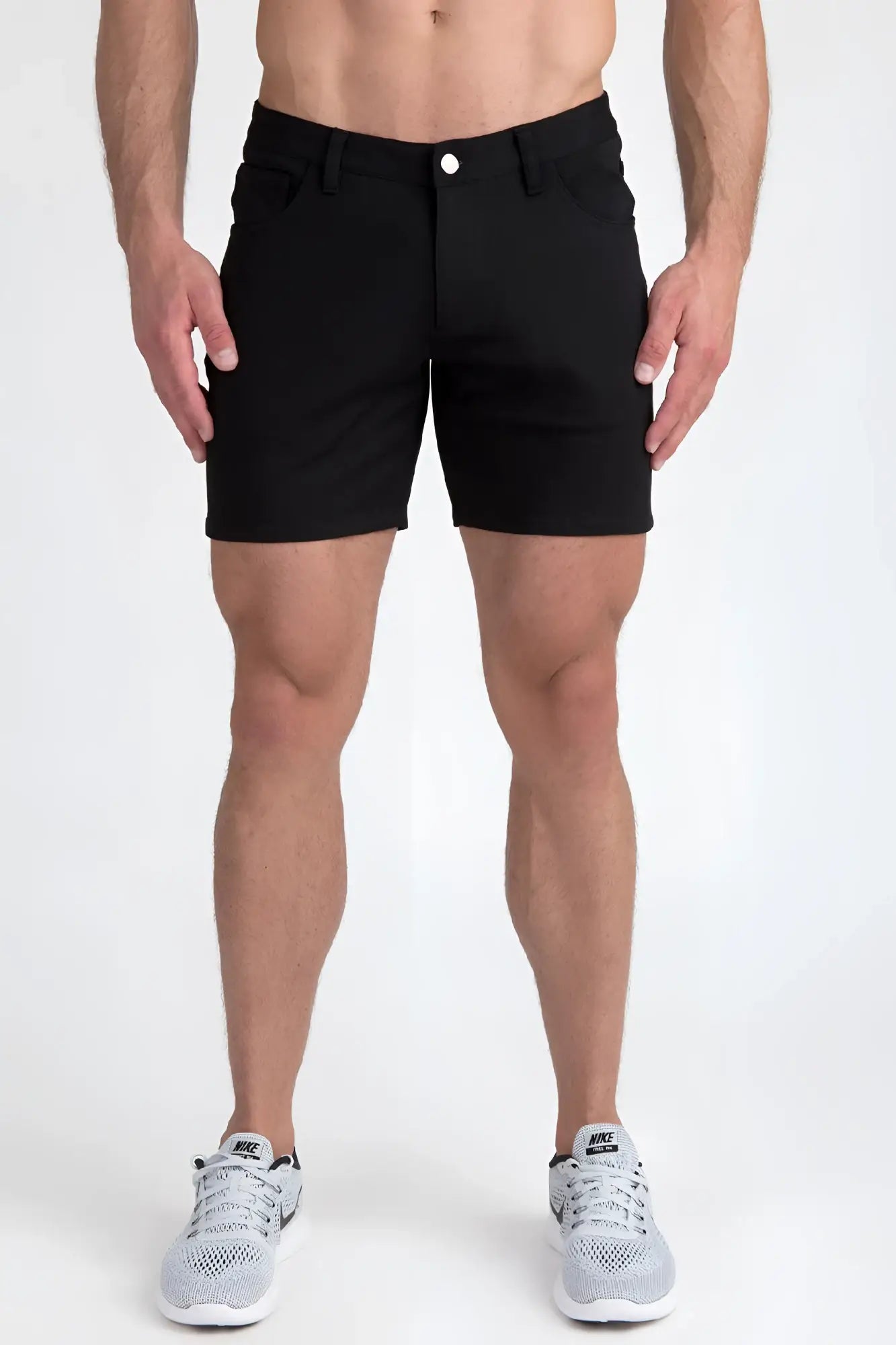 Black stretch knit shorts with a classic five-pocket design and a single white button closure