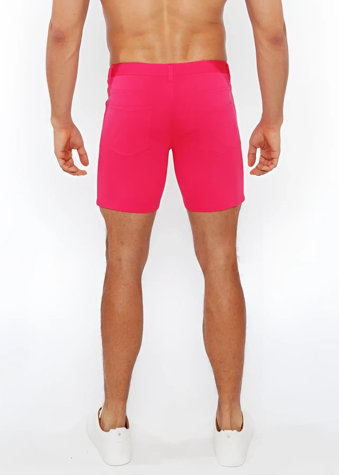 Bright pink stretch knit shorts with fitted waistband and side pockets for athletic use