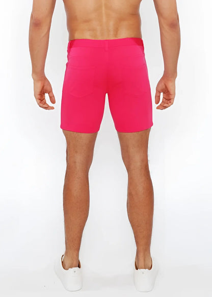 Bright pink stretch knit shorts with fitted waistband and side pockets for athletic use