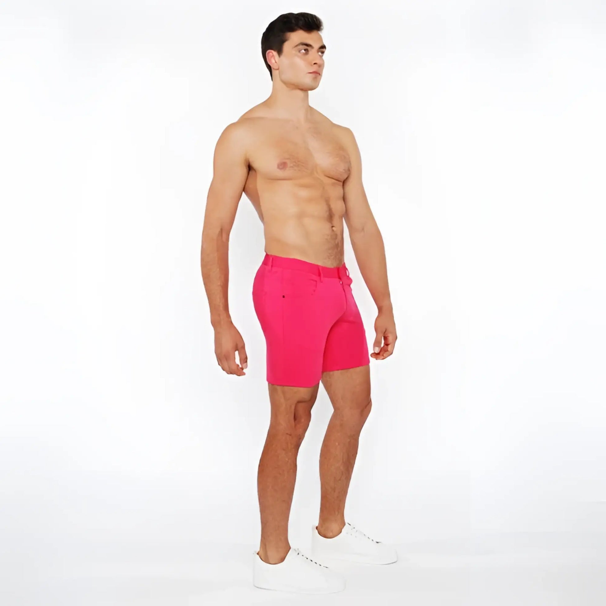Bright pink stretch knit shorts with tailored fit and belt loops for athletic and casual wear