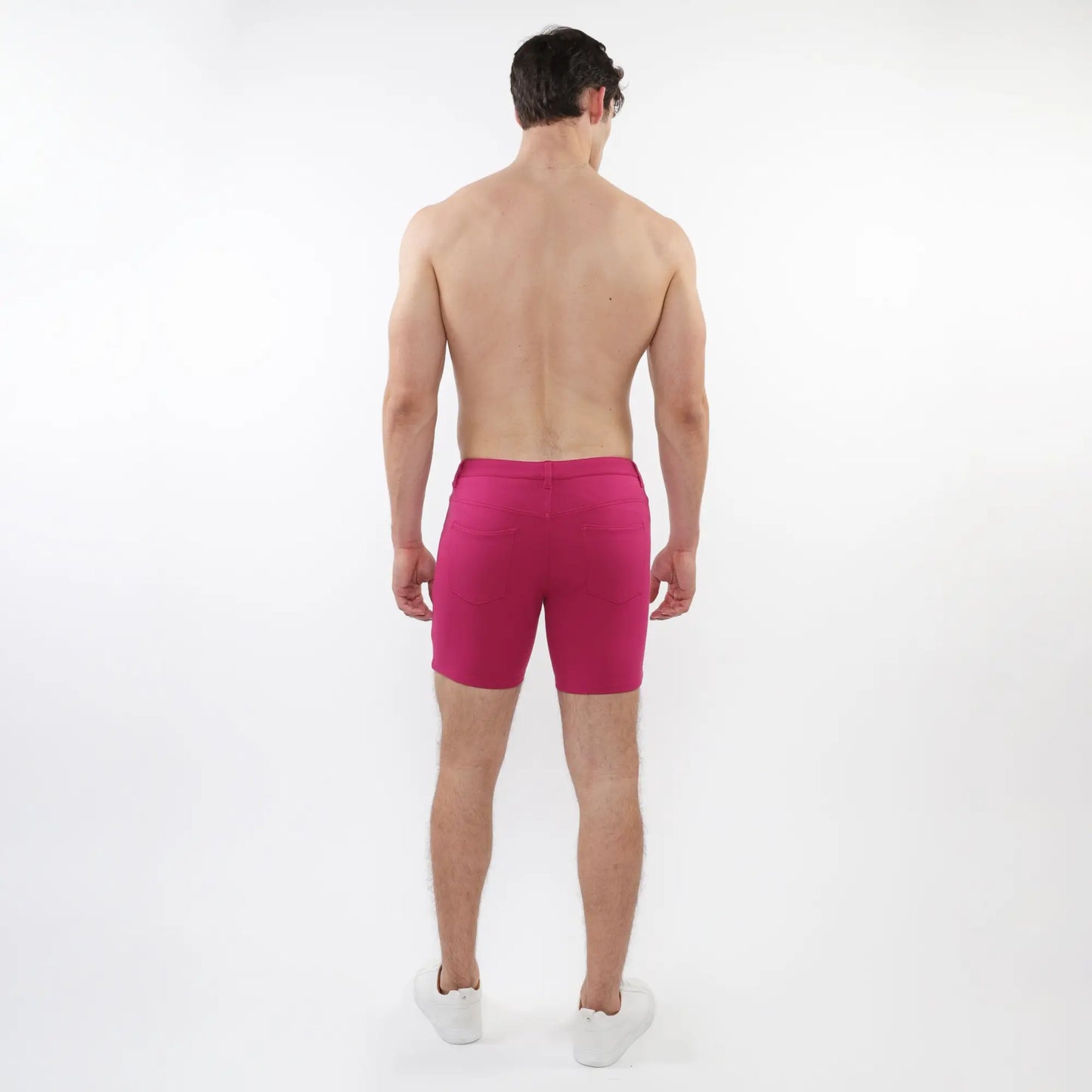 Fuchsia stretch knit shorts with fitted cut and elastic waistband designed for athletic use
