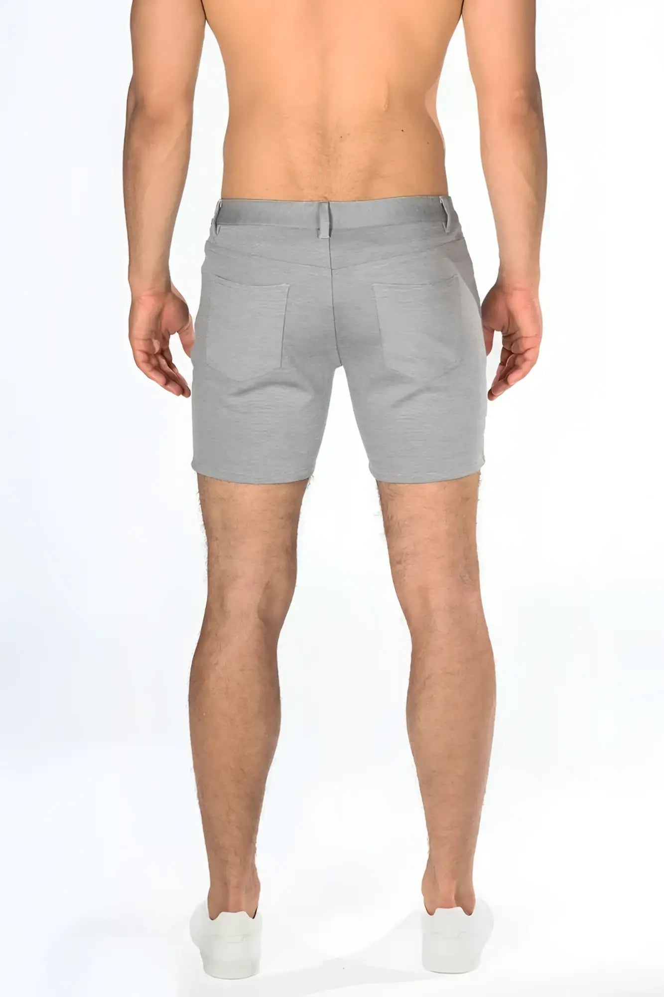 Gray stretch knit shorts in tailored fit with two back pockets shown from the back side