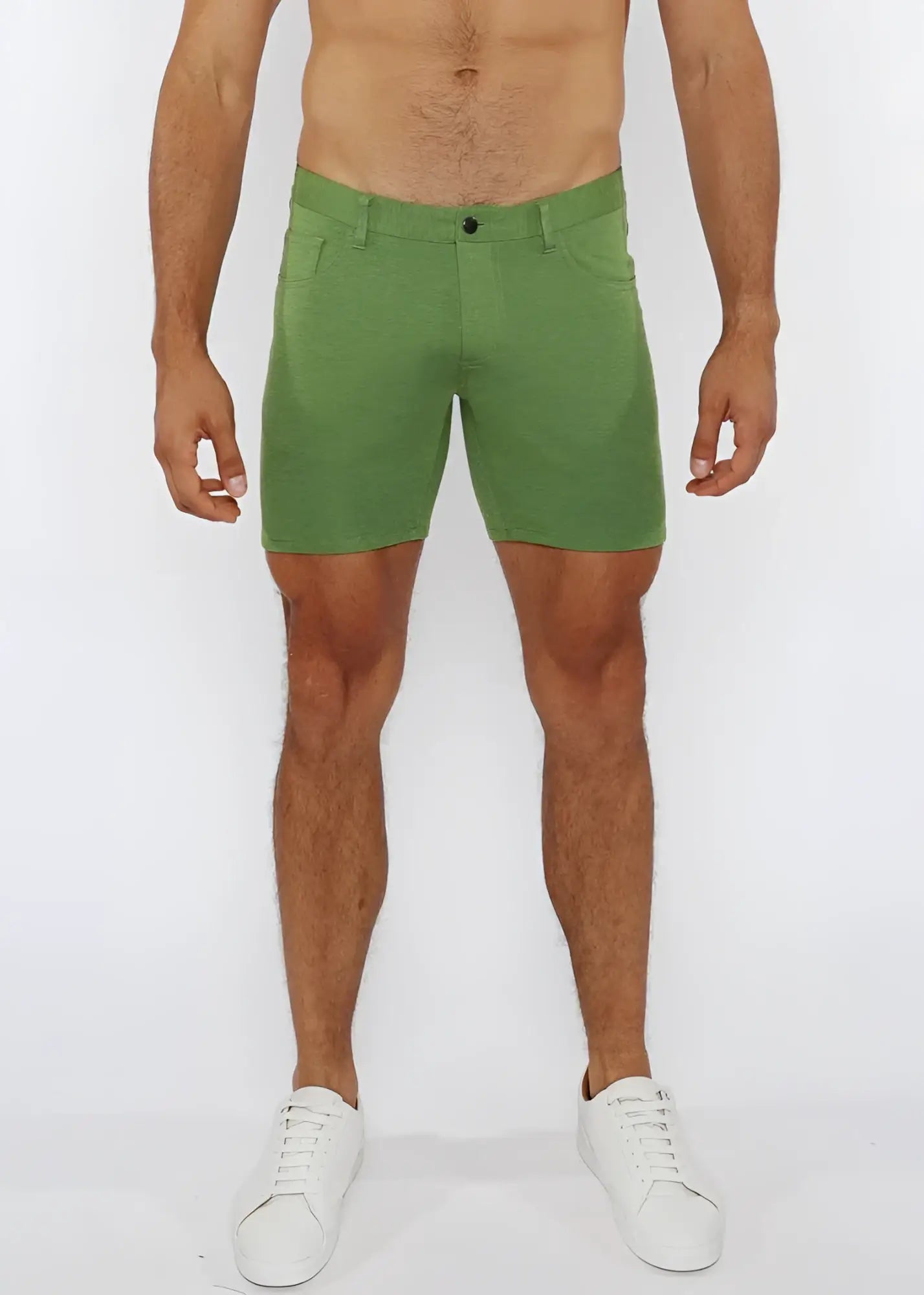 Green stretch knit shorts with subtle textured fabric and classic five-pocket design for comfortable wear