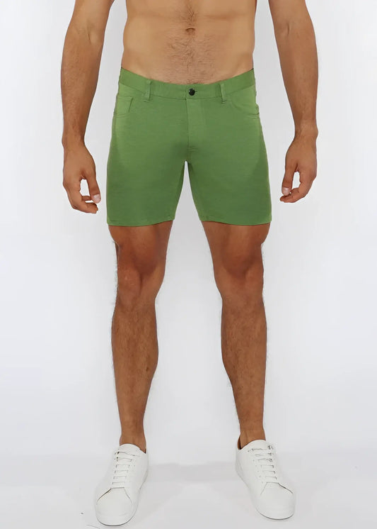 Green stretch knit shorts with subtle textured fabric and classic five-pocket design for comfortable wear