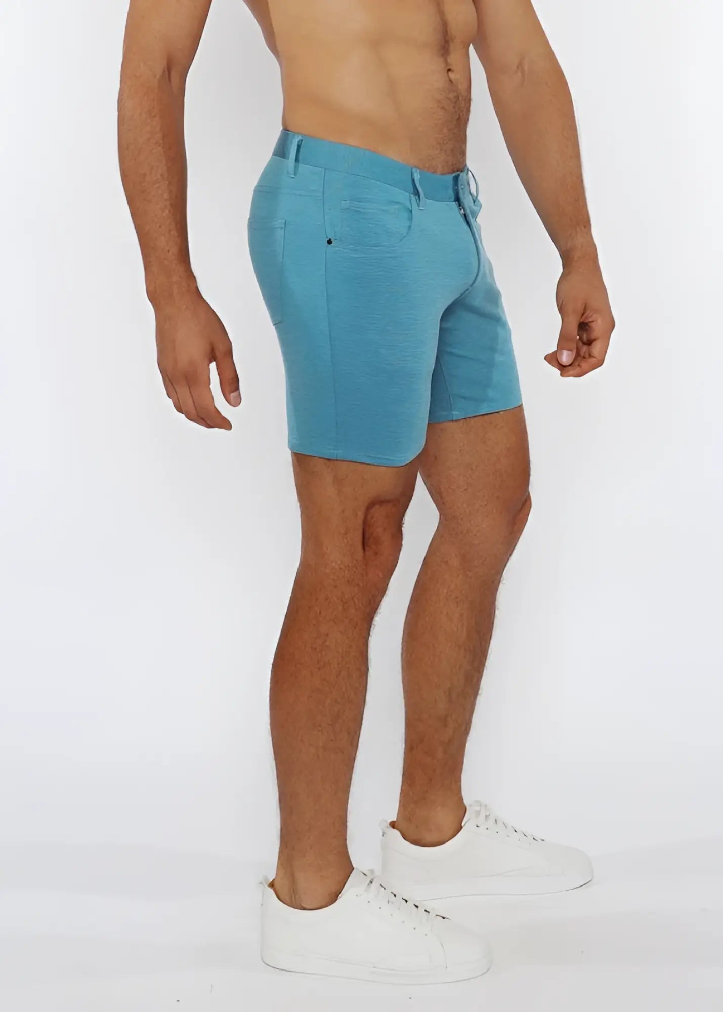 A pair of men’s stretch knit shorts in light blue with tailored fit and visible stitching details