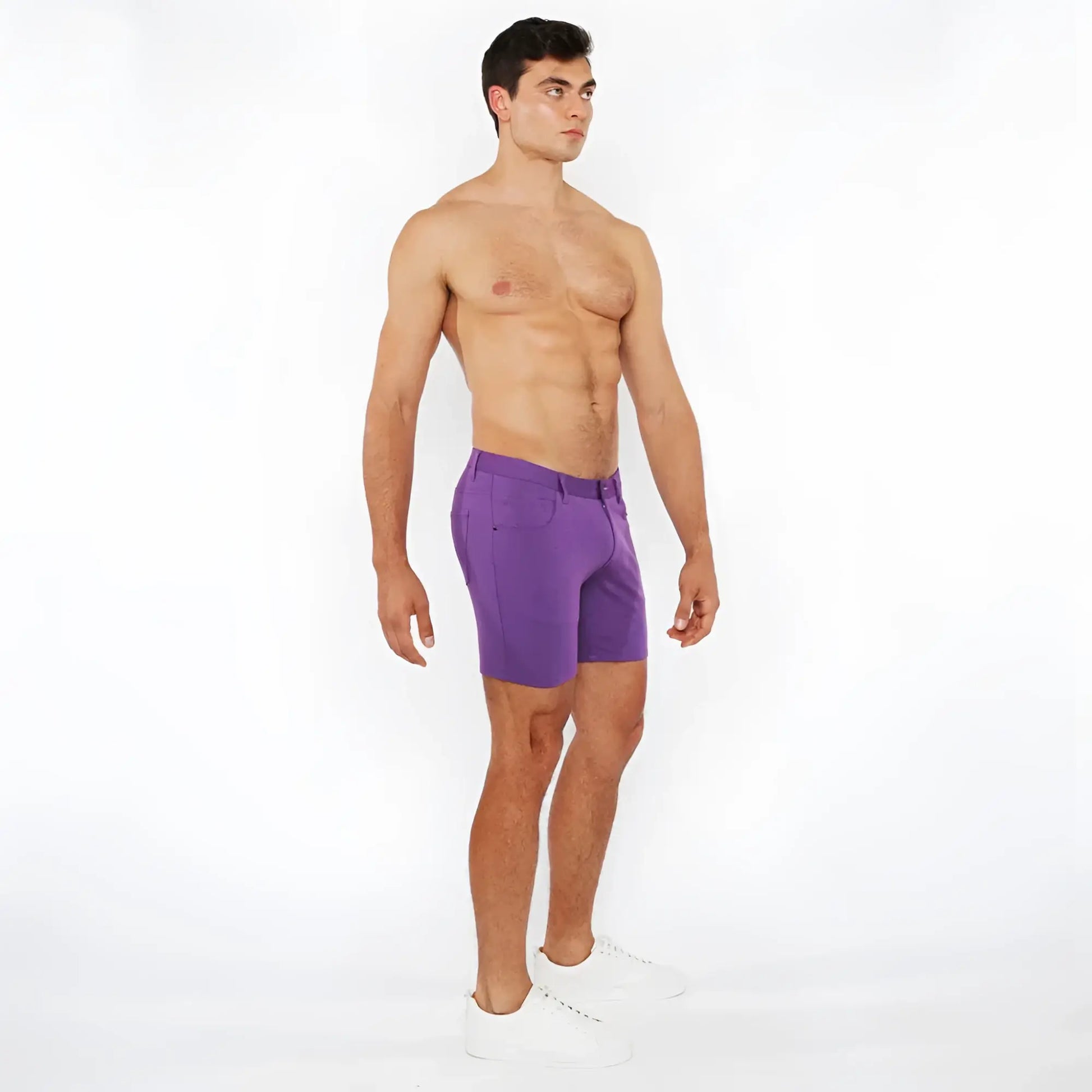 Purple stretch knit athletic shorts with tailored fit and subtle side pockets for comfortable active wear