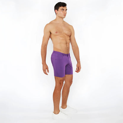 Purple stretch knit athletic shorts with tailored fit and subtle side pockets for comfortable active wear