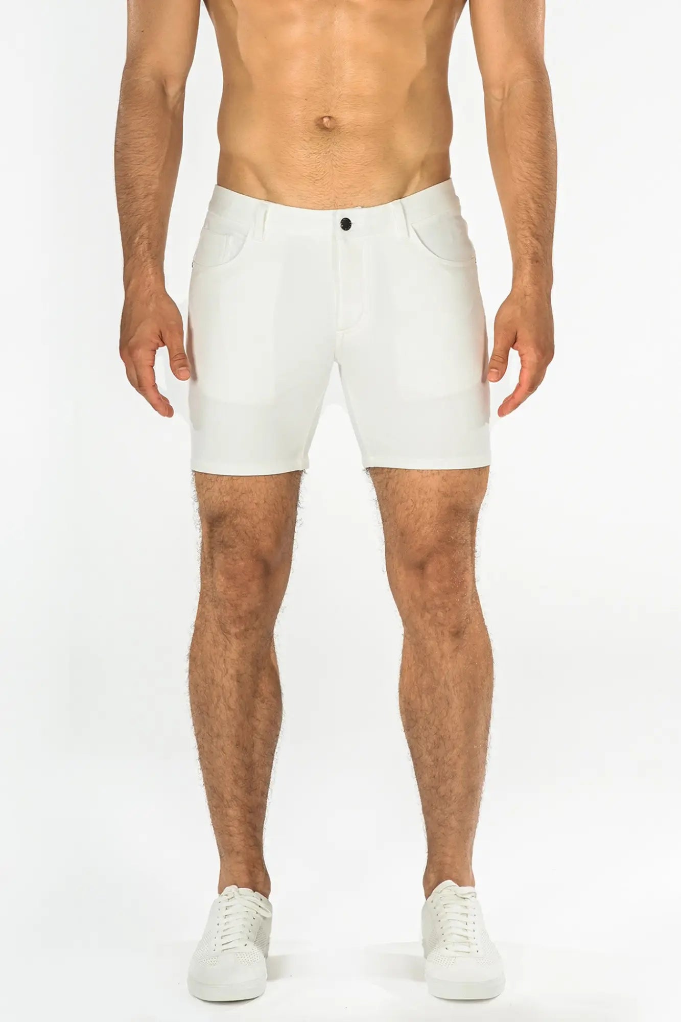 White stretch knit athletic shorts with sleek modern design and subtle stitching details