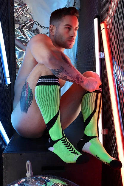 Neon green and black striped knee-high sucker socks with a textured ribbed knit design