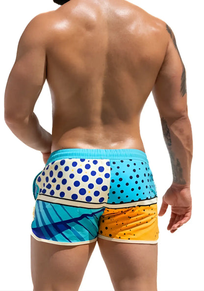 Super dog swim short vibrant patchwork swim trunks in turquoise white with blue polka dots and yellow orange hues