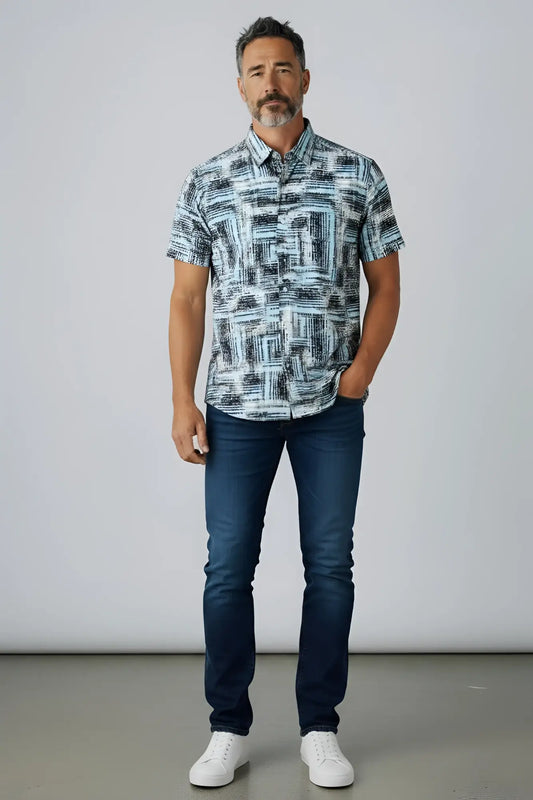 A man wearing a suslo crinkled fabric short-sleeved shirt with an abstract gray and white geometric pattern