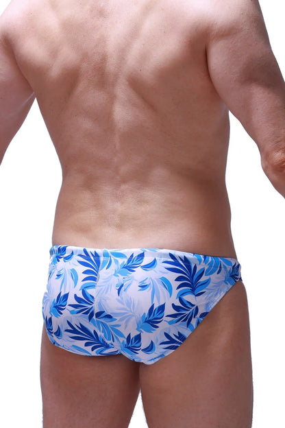 Swim bikini taik maeha blue and white tropical leaf patterned swim trunks designed for casual beachwear
