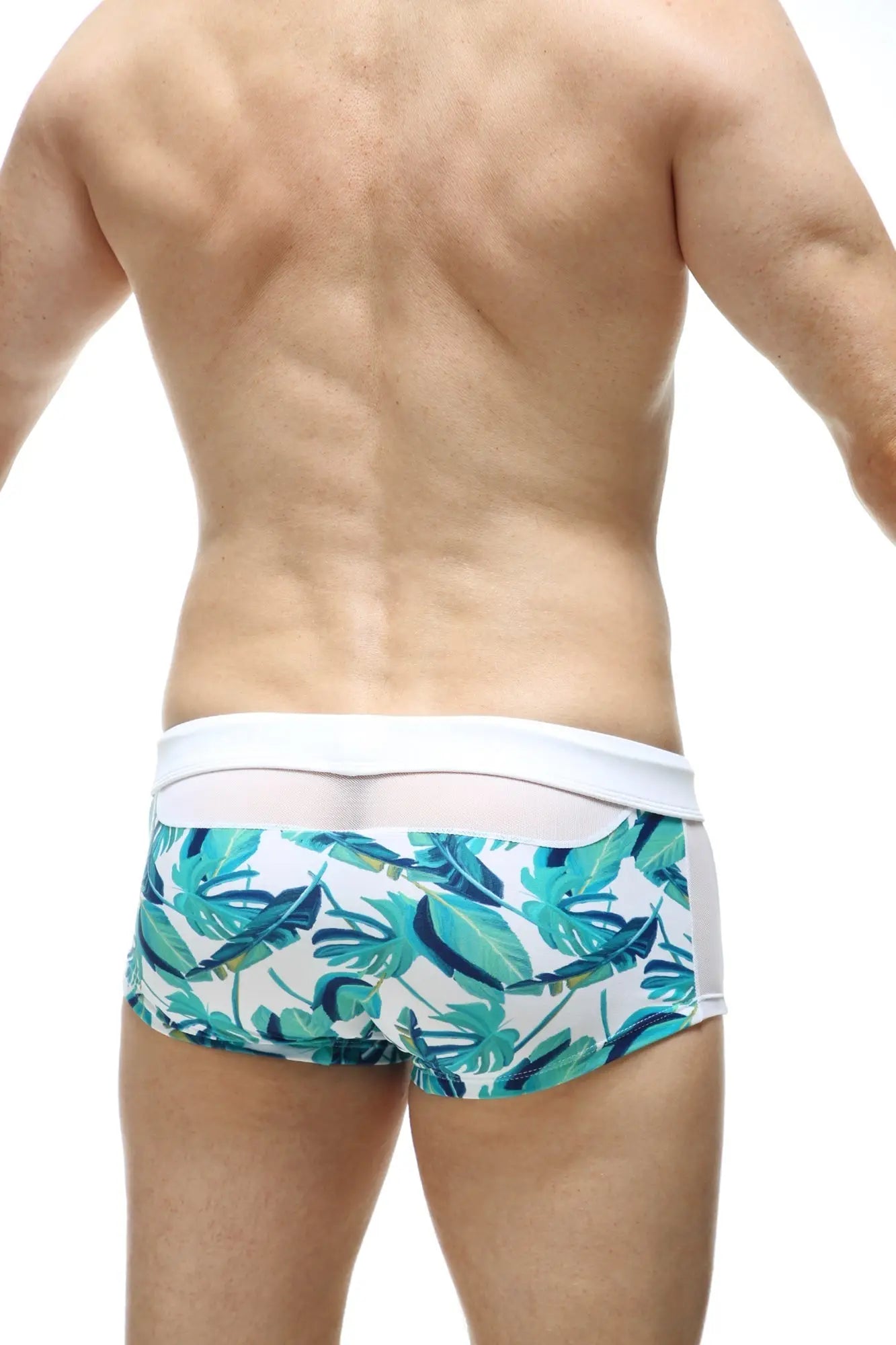 White swim boxer macouba with vibrant teal and green tropical leaf pattern designed for swimwear use