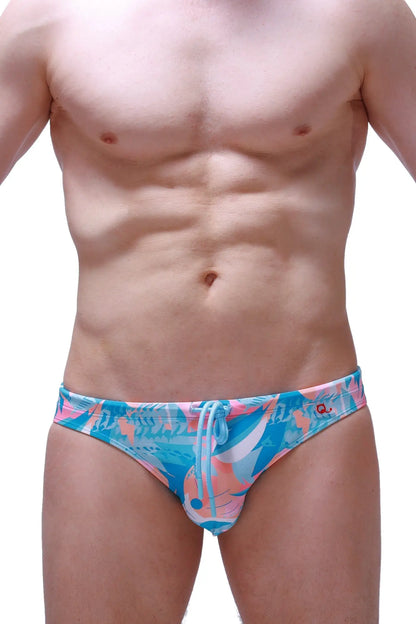 Vibrant blue and pink tropical print swim brief nant boucan with drawstring waistband for beachwear and swimming