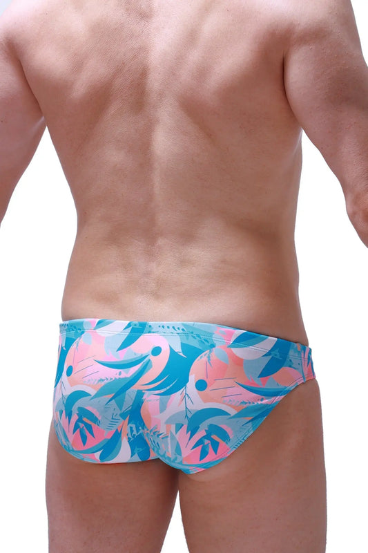 Swim brief Nant Boucan featuring vibrant pink and teal tropical patterned fabric with a bold abstract design