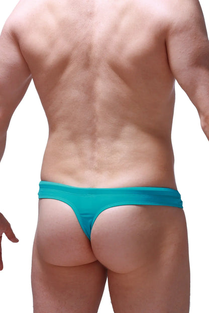 Teal swim thong green made of stretchy fabric with a snug fit and minimalistic design shown from the back side