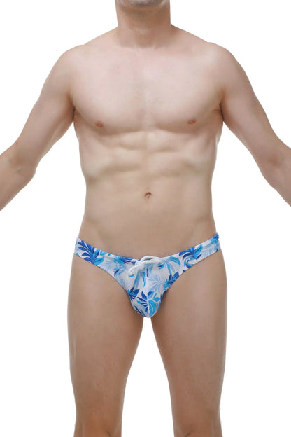 Swim thong maeha in blue and white tropical leaf pattern with drawstring waistband for beachwear