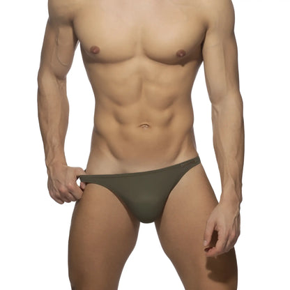 Olive green swimwear g-string briefs with sleek minimalist design and smooth fabric finish shown from the back side