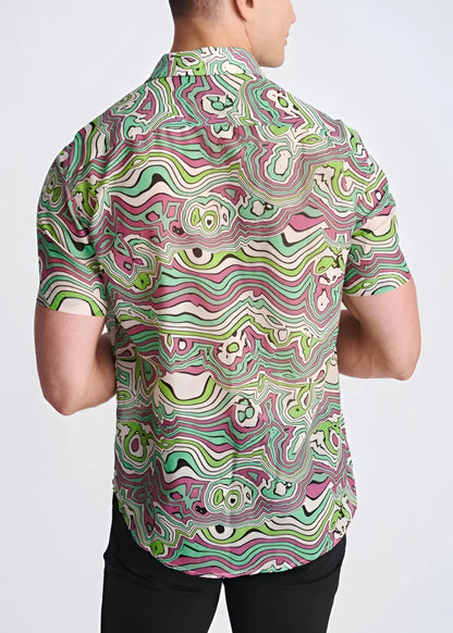 A vibrant short-sleeved lightweight cotton silk shirt with a psychedelic green pink and white swirling pattern