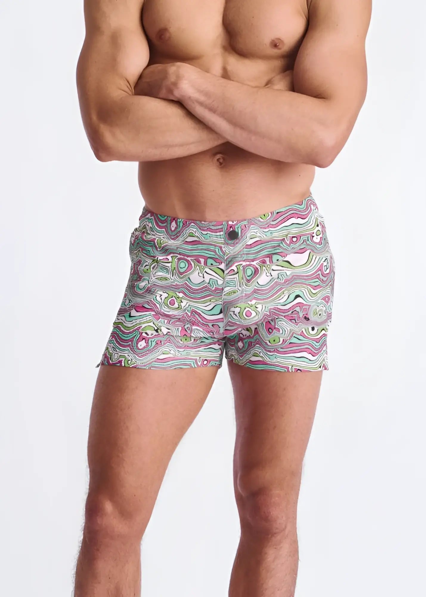 Swirls print seersucker swim shorts with mesh lining featuring vibrant pink green and white wavy abstract patterns