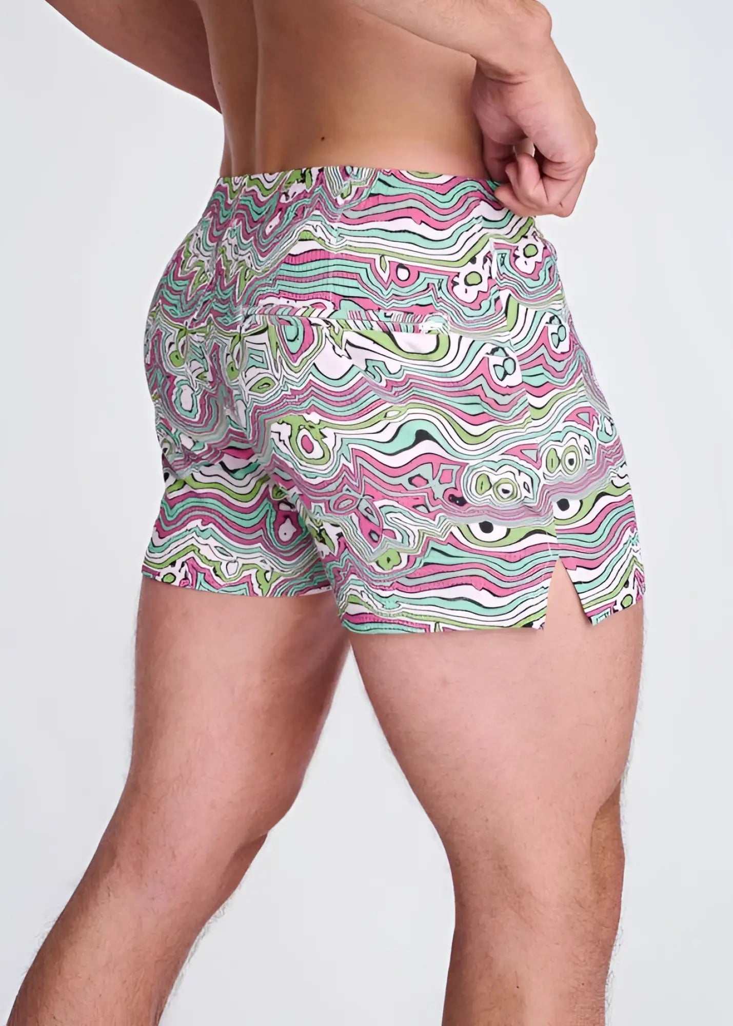 Swirls print seersucker swim shorts with mesh lining in vibrant pink green and white psychedelic wavy abstract pattern