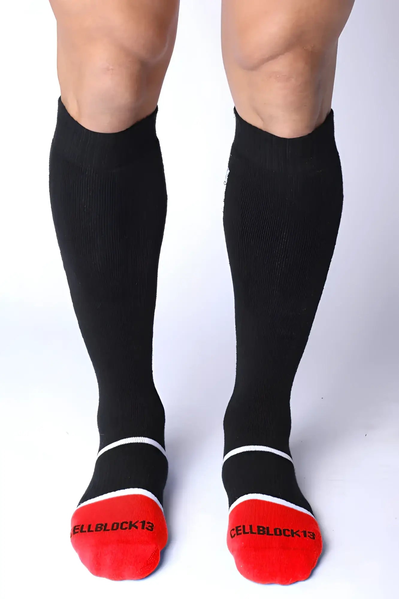 Take down knee high black compression socks with red toe caps white trim and cellblock13 logo on each foot