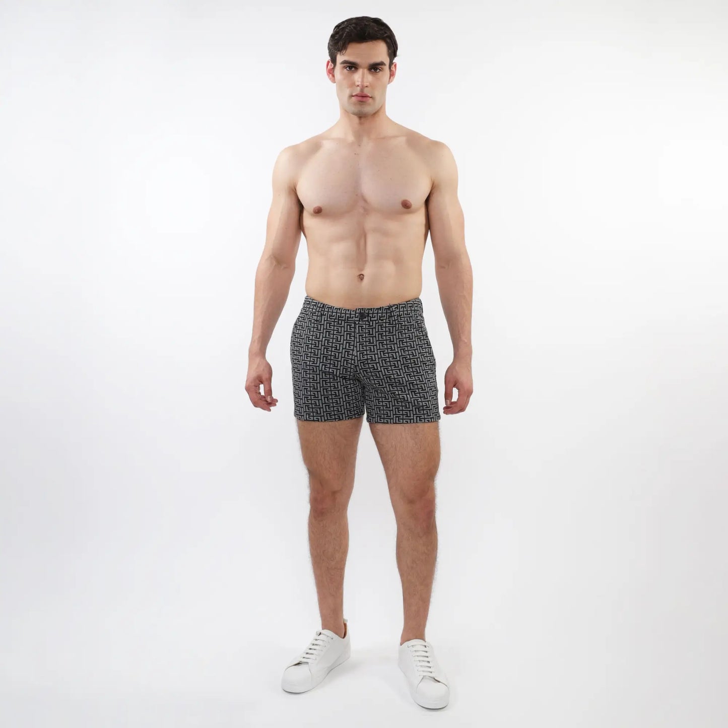Textured jacquard stretch knit chino shorts with zip pockets in black and white geometric pattern for men