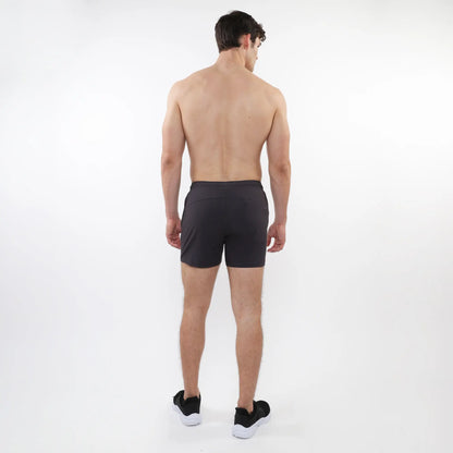 Black textured mesh stretch performance shorts with a sleek form-fitting design and subtle side pockets