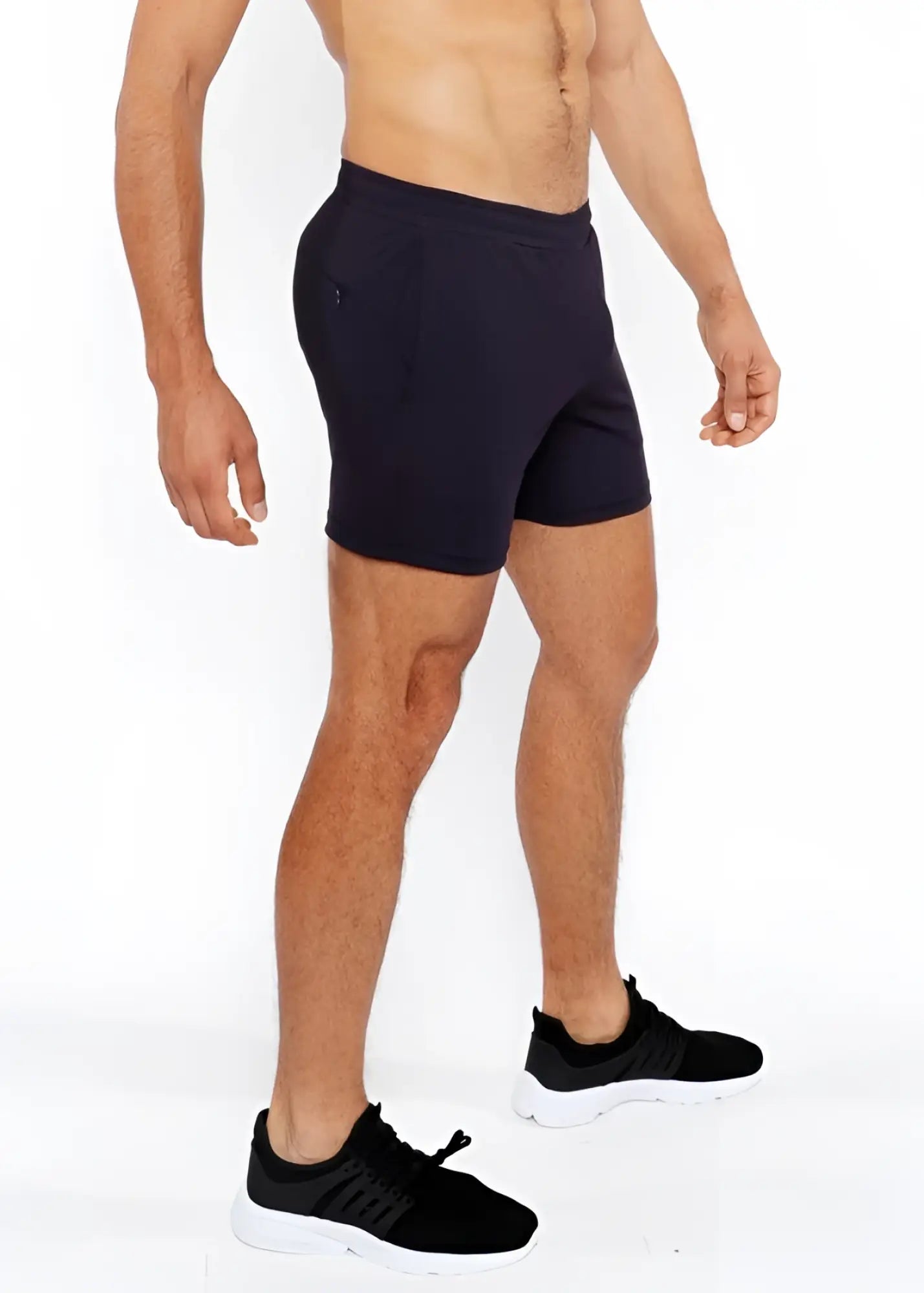 Black textured mesh stretch performance shorts with a sleek form-fitting design and subtle side pockets
