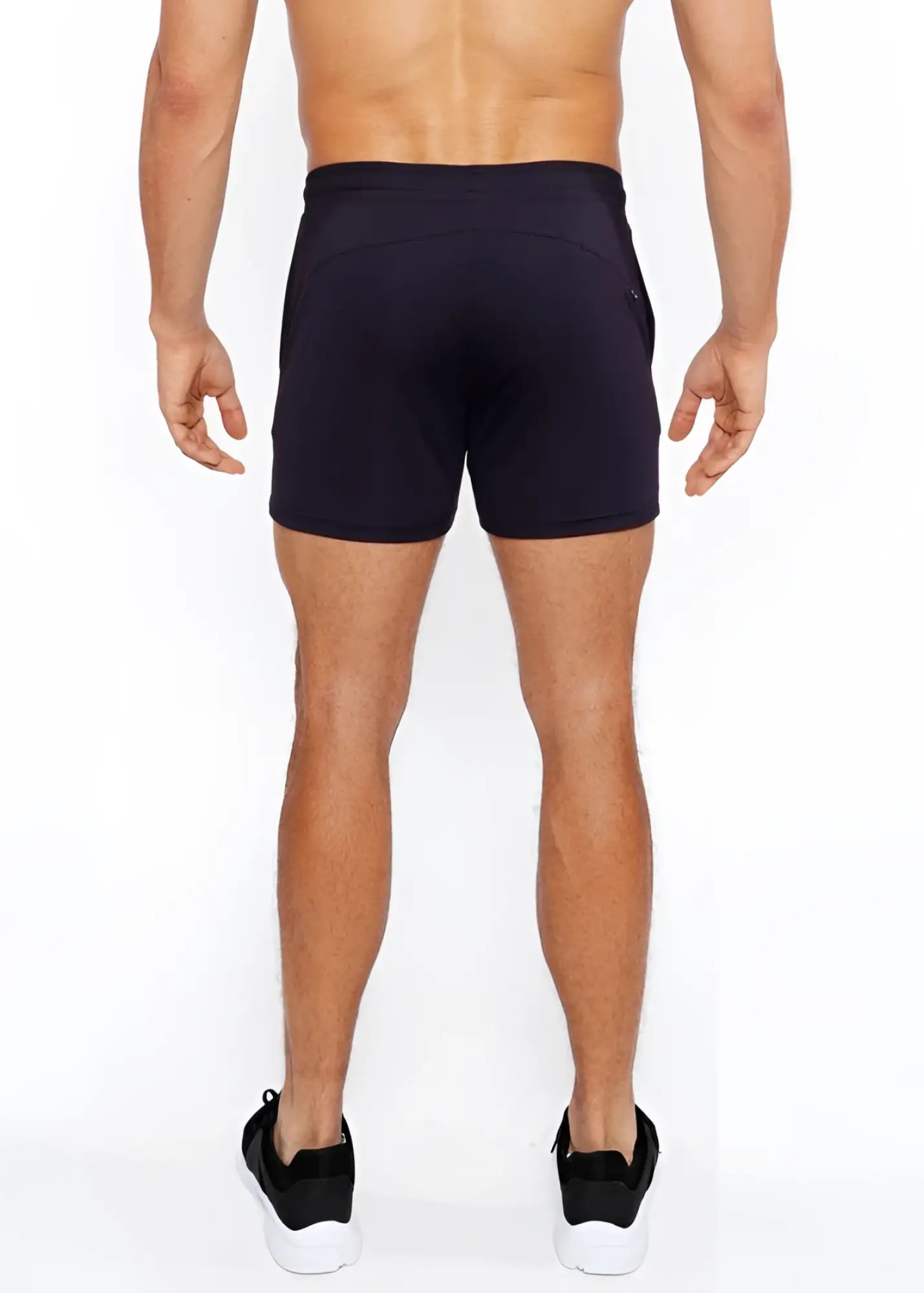 Black textured mesh stretch performance shorts with sleek form fitting design and subtle side pockets