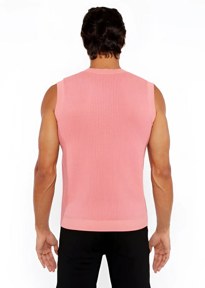 A pink ribbed knit sleeveless top with a crew neckline featured in the textured open knit vest collection