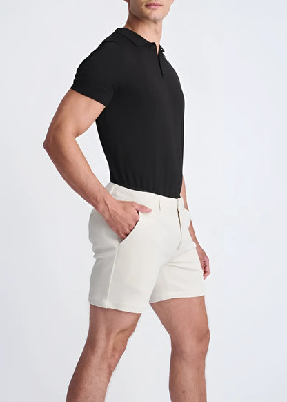 Cream-colored textured stretch knit chino shorts with a tailored modern cut and subtle side seam detailing