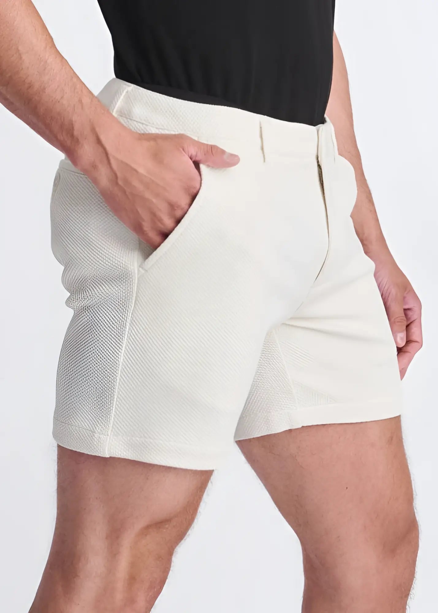 Cream-colored textured stretch knit chino shorts with tailored fit and side pockets for comfortable style
