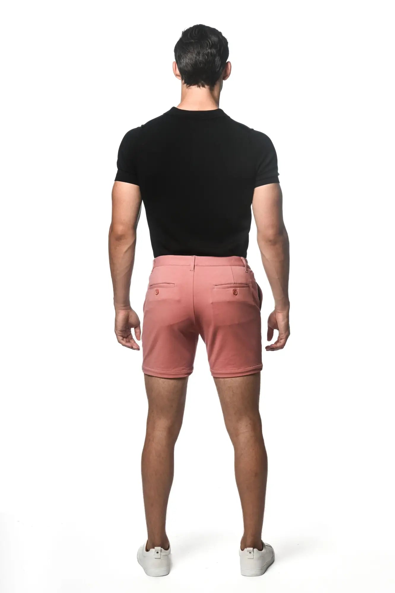 Crisp pink textured stretch knit chino shorts with tailored fit and subtle stitching details for casual wear